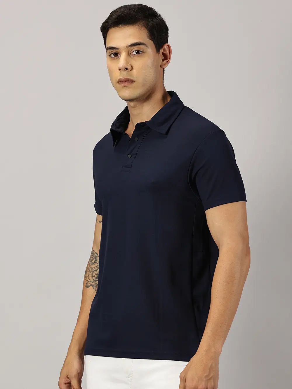 A model wearing Blue Tyga navy blue odor-free polo t-shirt