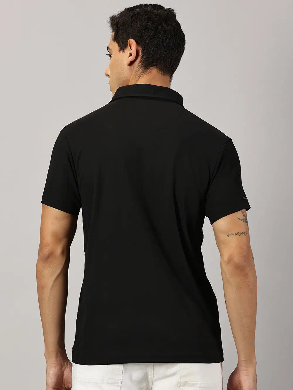 A model wearing Blue Tyga black odor-free polo t-shirt
