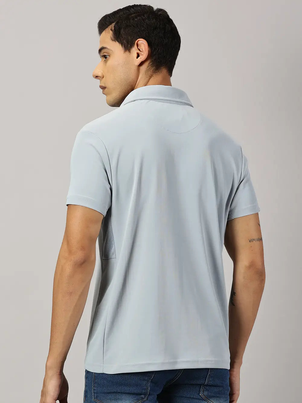 A model wearing Blue Tyga columbia blue odor-free polo t-shirt