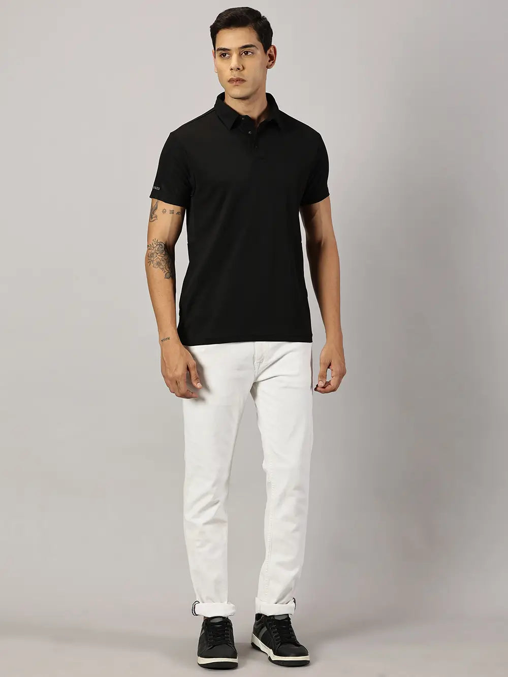 A model wearing Blue Tyga black odor-free polo t-shirt