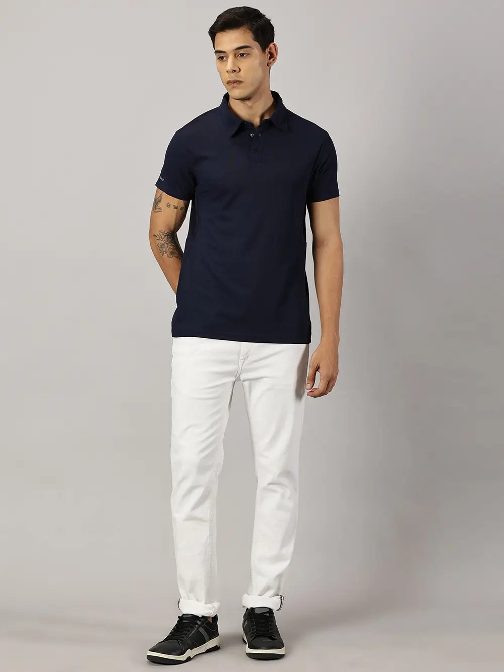 A model wearing Blue Tyga navy blue odor-free polo t-shirt
