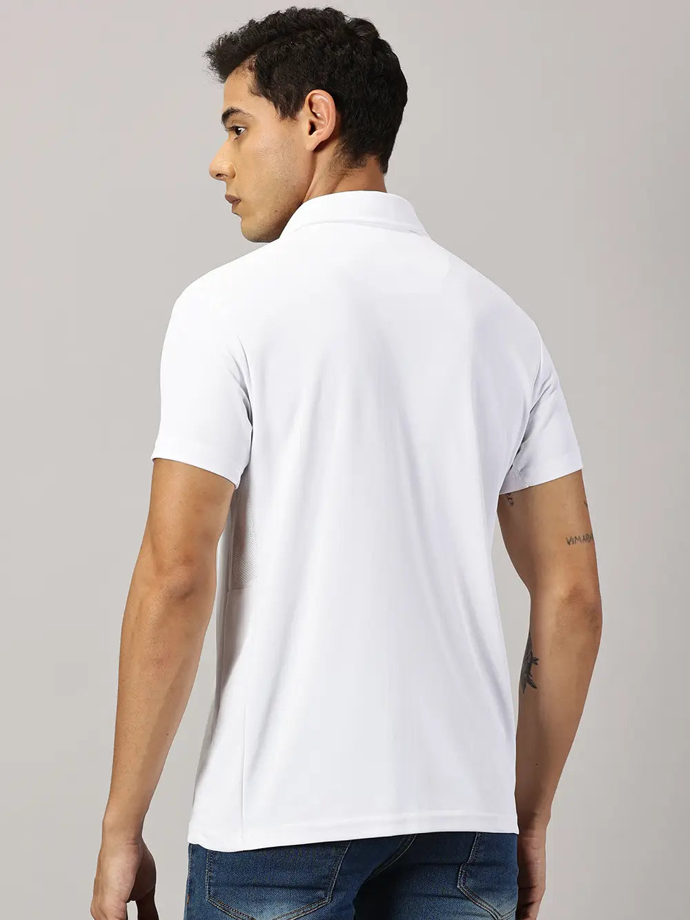 Back view of a model wearing Blue Tyga odor-free white polo t-shirt