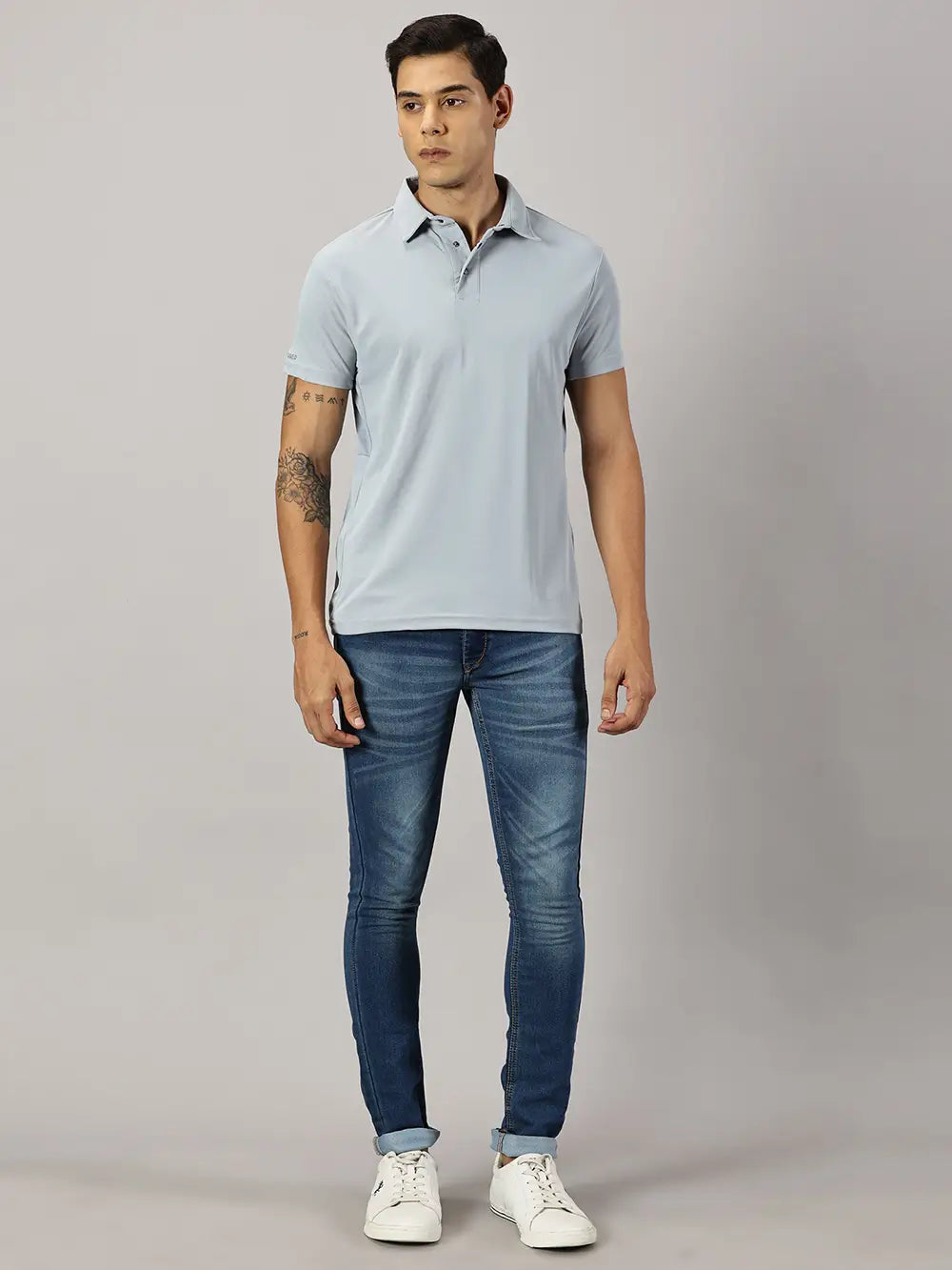 A model wearing Blue Tyga columbia blue odor-free polo t-shirt