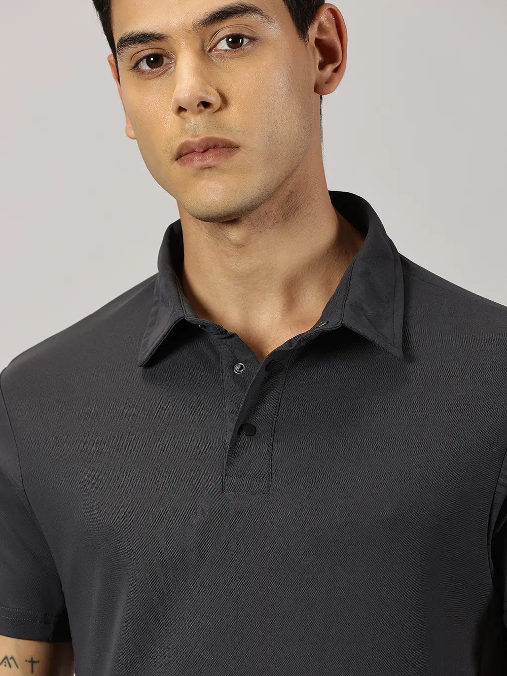 A model wearing Blue Tyga dark grey odor-free polo t-shirt