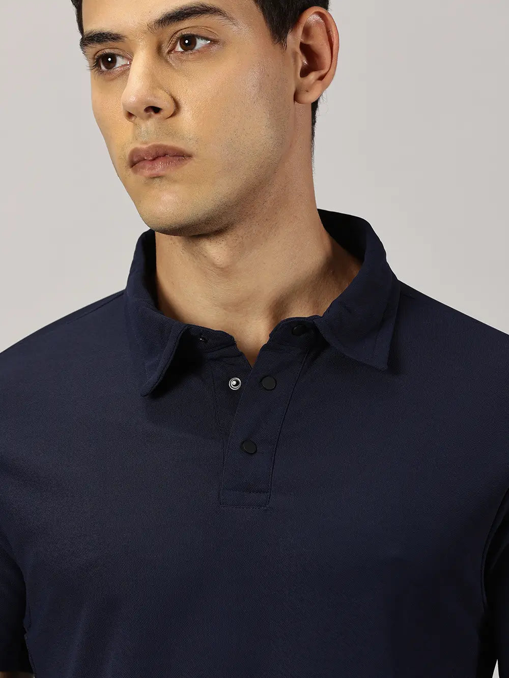 A model wearing Blue Tyga navy blue odor-free polo t-shirt