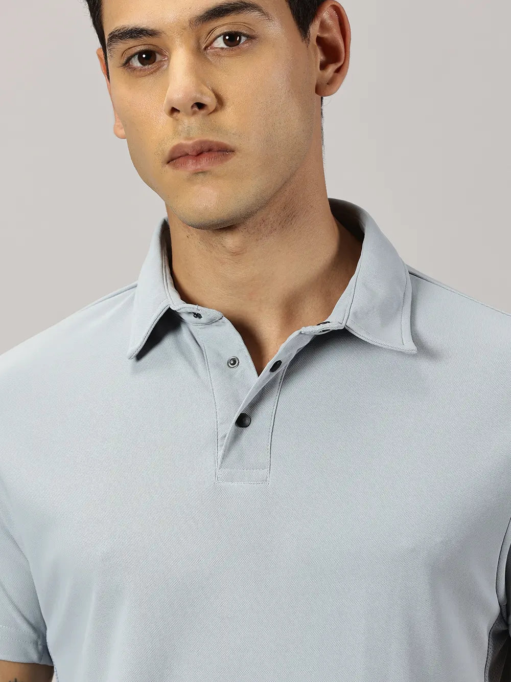 A model wearing Blue Tyga columbia blue odor-free polo t-shirt