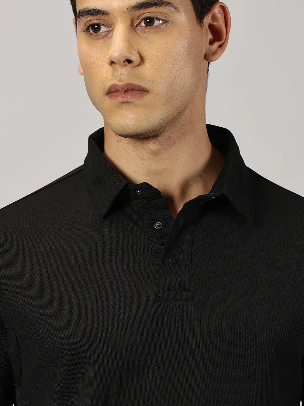 A model wearing Blue Tyga black odor-free polo t-shirt