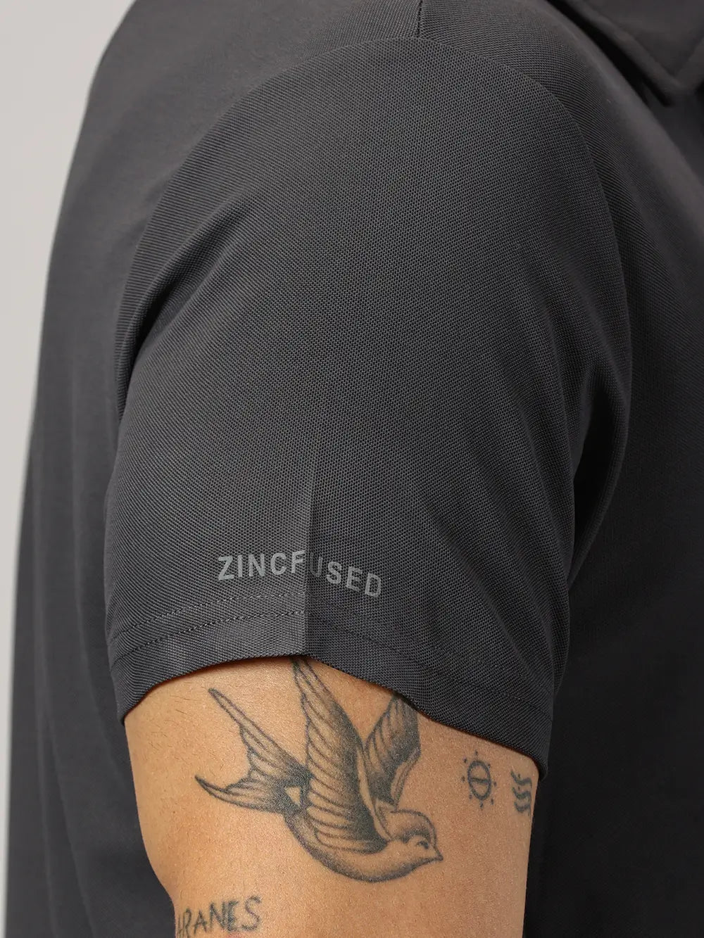 A model wearing Blue Tyga dark grey odor-free polo t-shirt