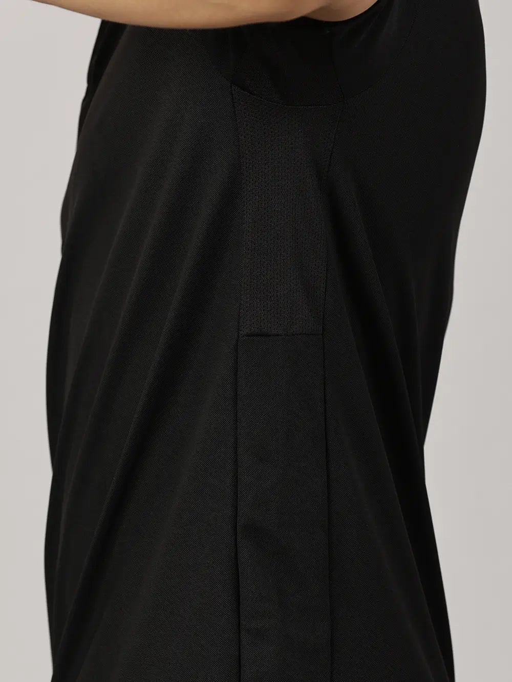 A model wearing Blue Tyga black odor-free polo t-shirt