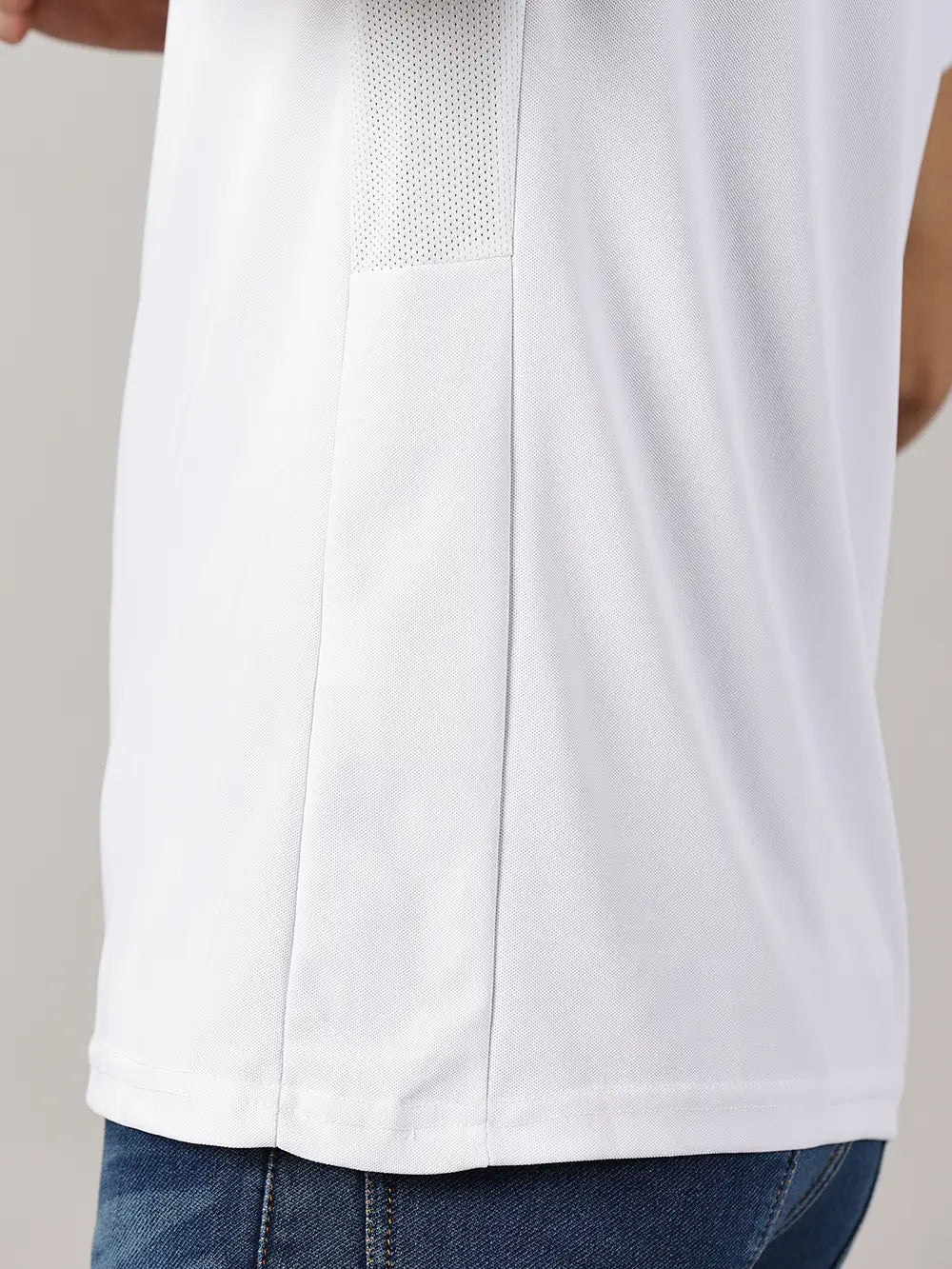 Close shot of a model wearing Blue Tyga odor-free white polo t-shirt