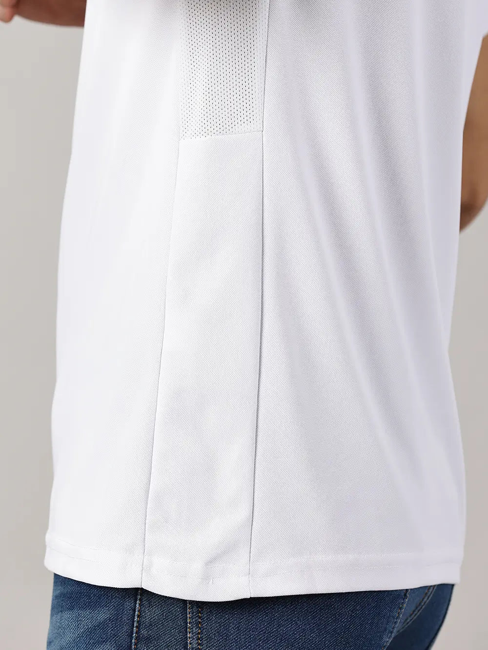 Close shot of a model wearing Blue Tyga odor-free white polo t-shirt