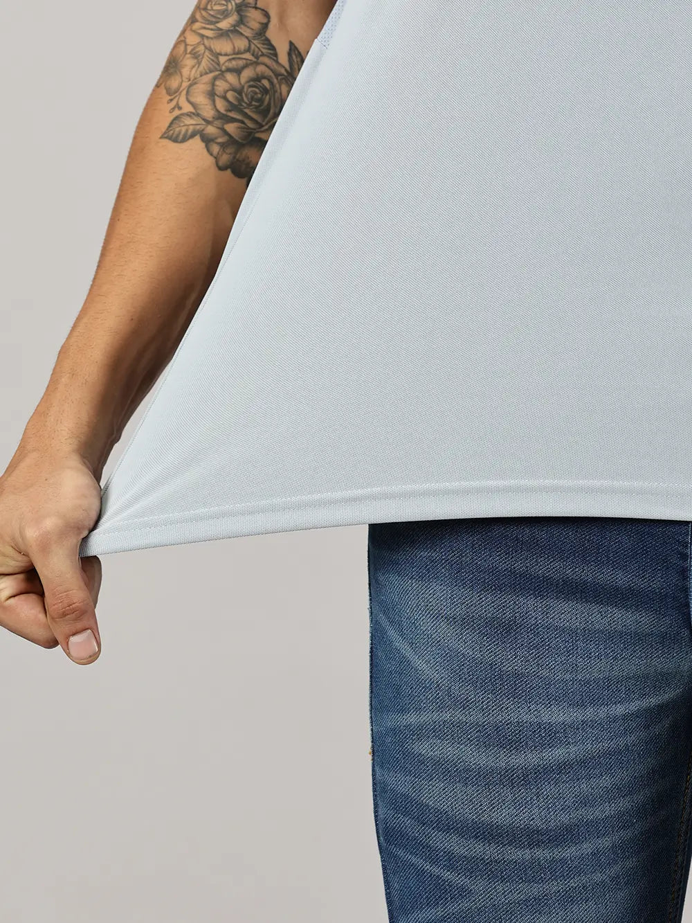 A model wearing Blue Tyga columbia blue odor-free polo t-shirt