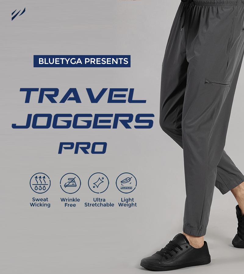 Promotional banner for BlueTyga Travel Joggers Pro featuring a man modeling the grey joggers paired with black shoes, highlighting key product features like sweat wicking, wrinkle-free, ultra-stretchable, and lightweight design